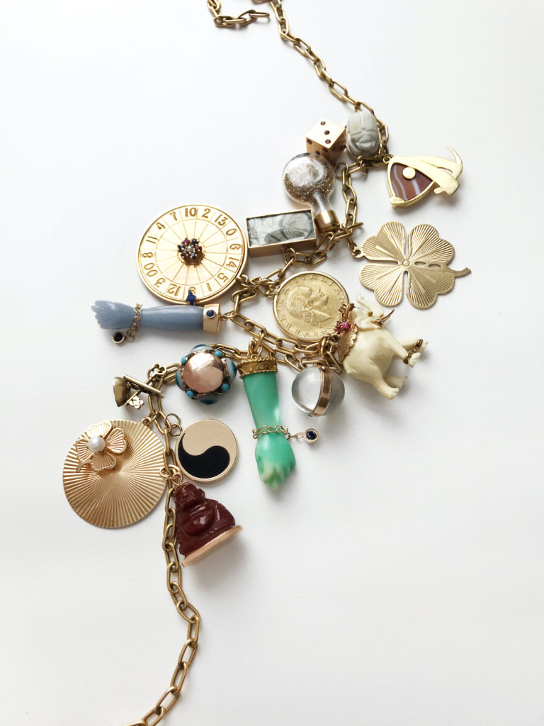 A necklace displaying new and vintage selections, including a classic Figa charm