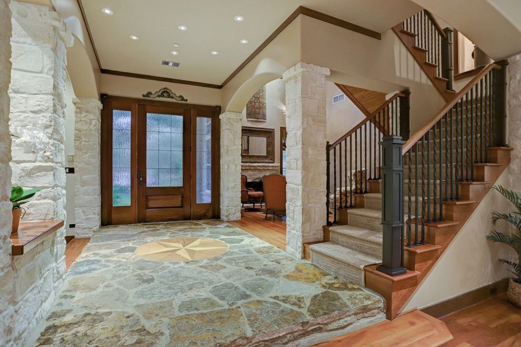 The stone star-studded entryway speaks of the home's Southern feel. 
