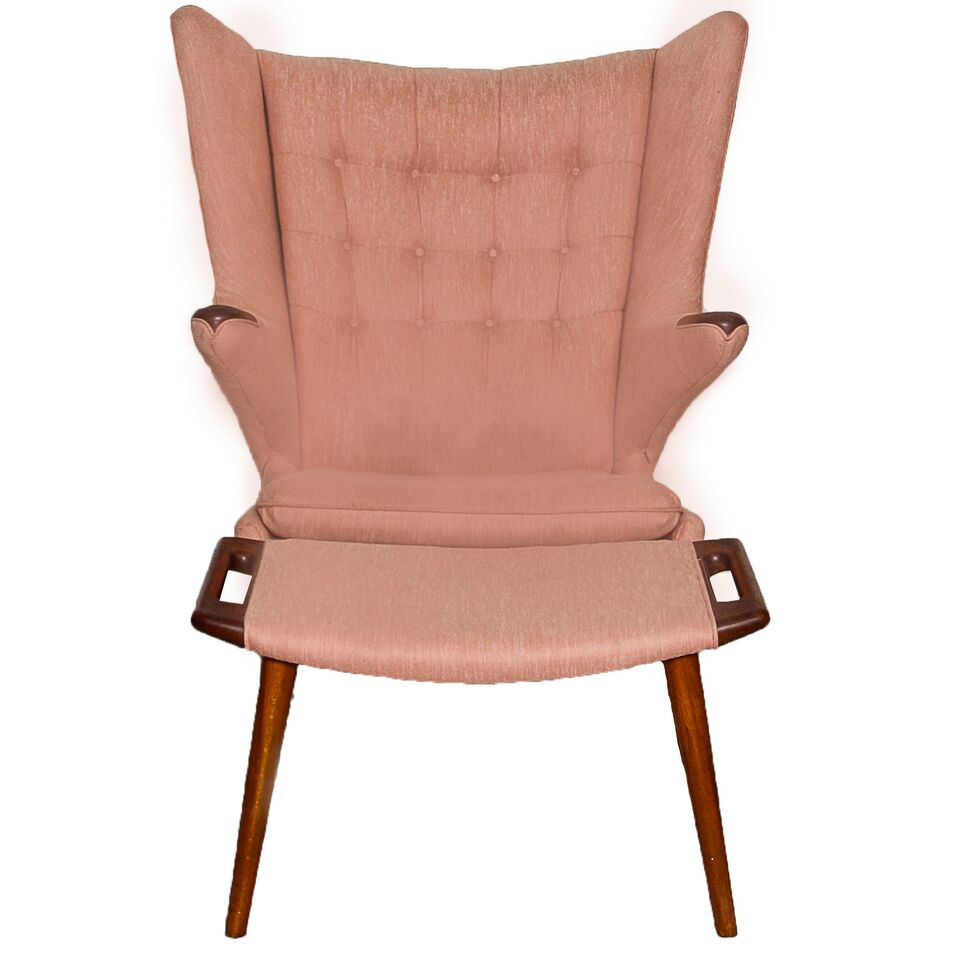 This teak Hans Wegner "Papa Bear" pink upholstered armchair comes with an ottoman. 