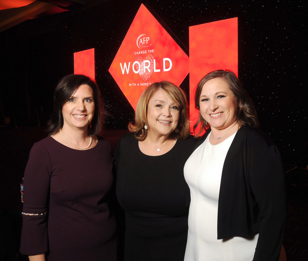 From left: Melissa Simon, Marilu Garza and Amy Lampi at the 2018 National Philanthropy Day's "Change the World with a Hero's Heart" Awards Luncheon at the Hilton Americas Hotel Thursday Nov. 15, 2018.(Dave Rossman Photo)