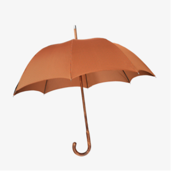The ultimate rain accessory is a chic umbrella. Available at Hermès stores: Dallas Highland Park Village and Houston Galleria and on the Hermès website.