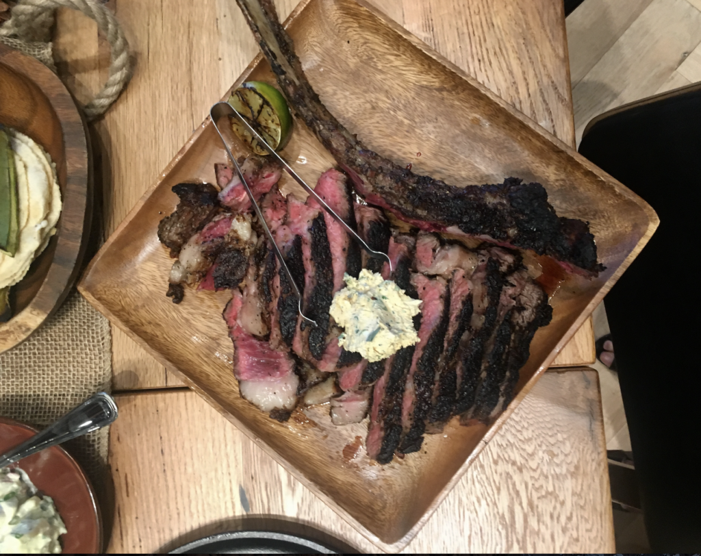 The massive tomahawk is a Houston-only dish. 