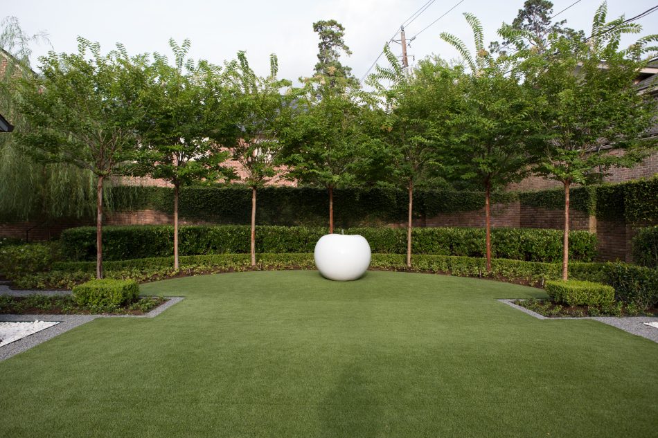 The ground was elevated to highlight the JANUS et Cie "Apple" art piece surrounded by crepe myrtles.
