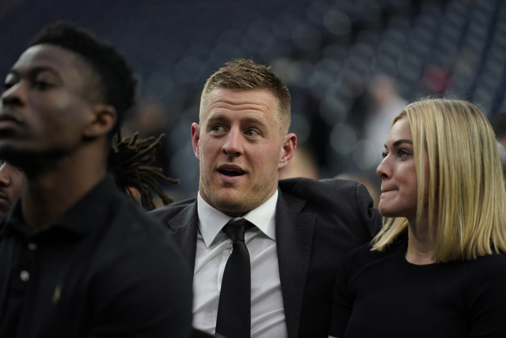 J.J. Watt and his girlfriend, Houston Dash player Kealia Ohai, attend  a public celebration of life for Houston Texans owner Robert C. McNair at NRG Stadium, Friday, Dec. 7, 2018, in Houston.  (AP Photo/David J. Phillip, POOL)