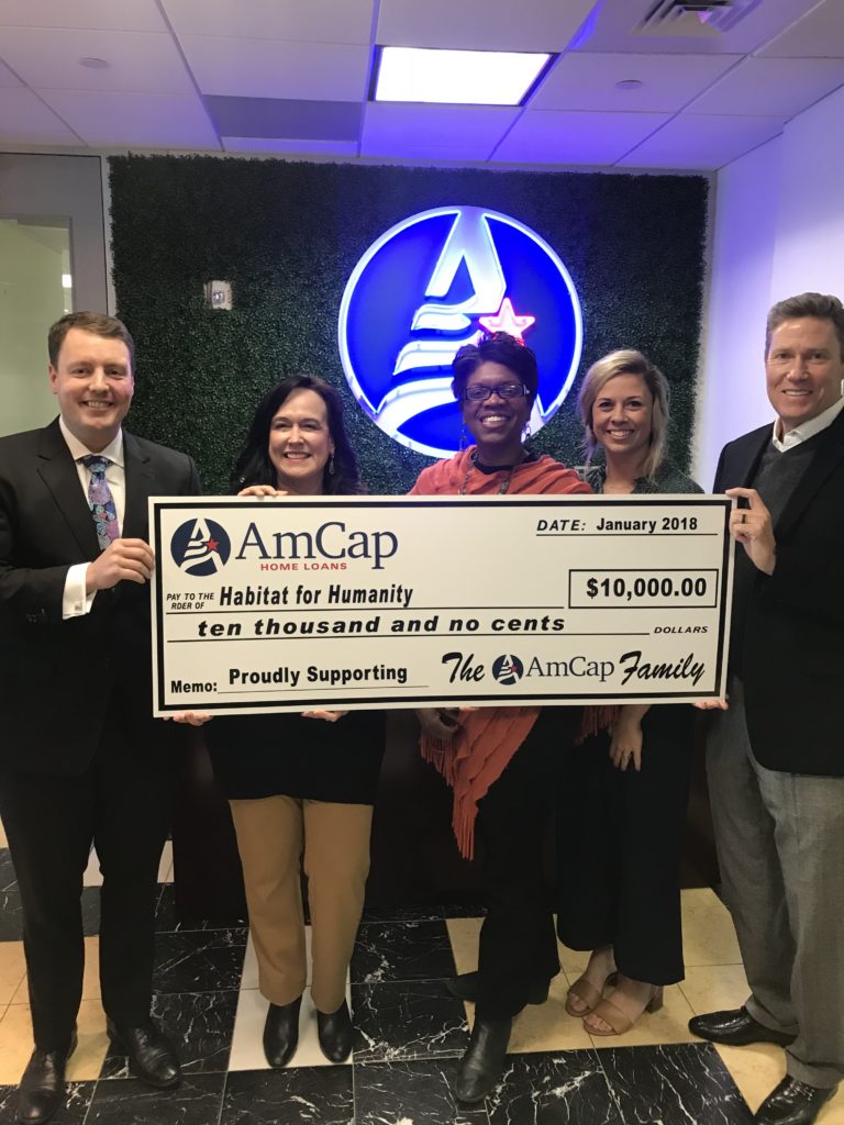 Amcap presents a check to a deserving charity.