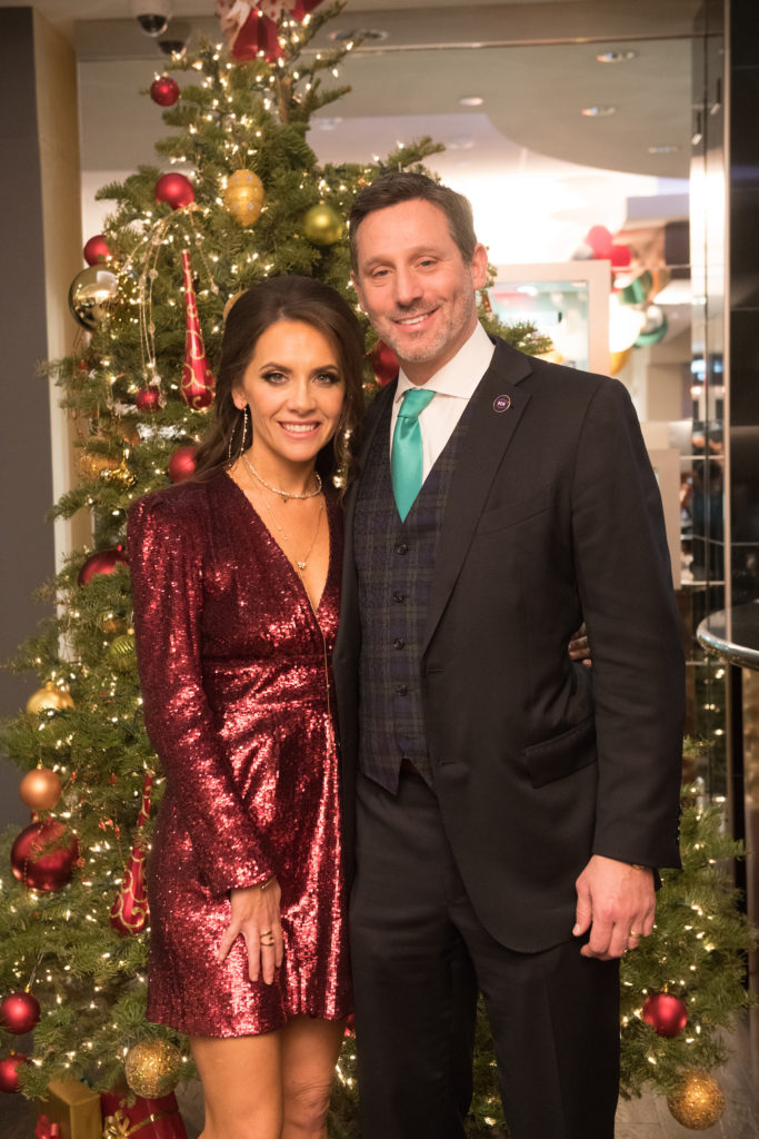 Joanna Hartland Marks & Brad Marks at a 2018 holiday party.