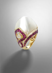 Mariana B Flaminia ring with cabochon moonstone, rubies, and pave diamonds $45,000, at Neiman Marcus