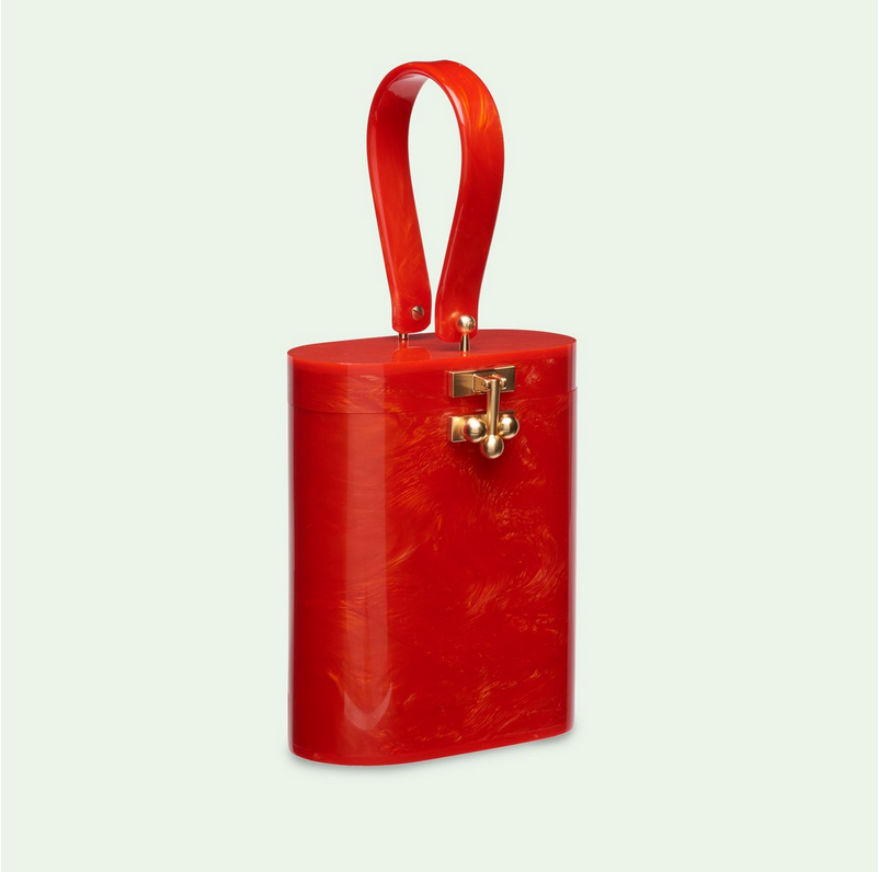 Deck the halls: Edie Parker oval bag in poppy makes a merry statement. You're also ahead of the game for Valentine's. $1,295, through Edie Parker. (edie-parker.com) 