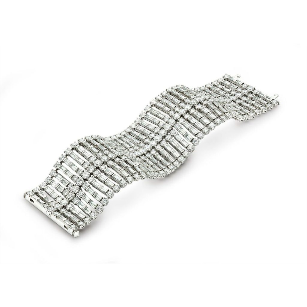 This High Jewelry Bracelet with round and baguette diamonds set in platinum makes a bold statement.  (65.56 ctw. Price on request)