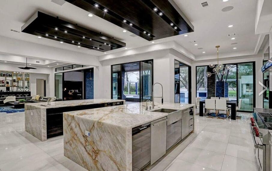 This killer contemporary Houston kitchen in a home at 3 West Rivercrest  opens to the 'beverage center,'  far left.