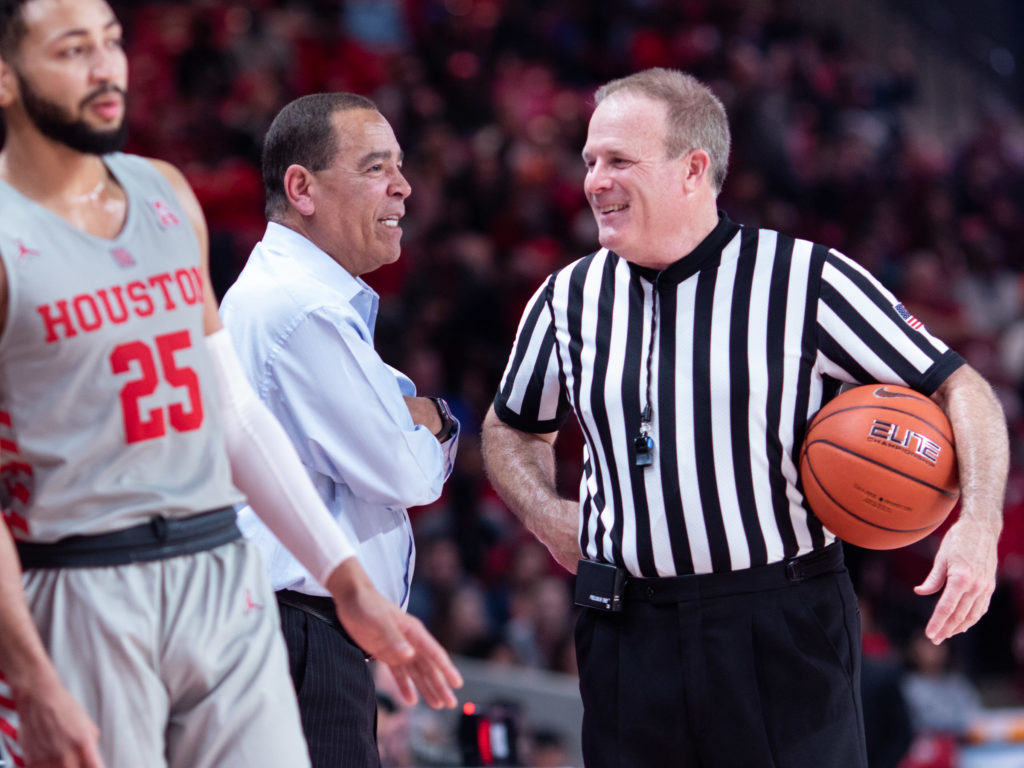 That's something of a rare sight. Houston coach Kelvin Sampson giving an official some love. (Photo by F. Carter Smith.)