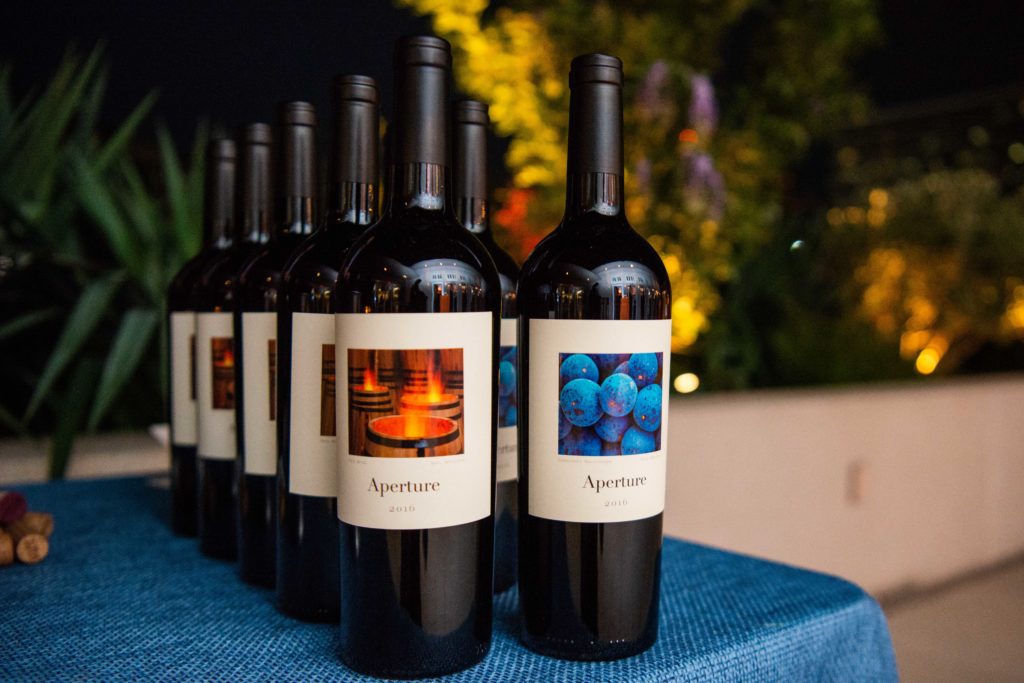 Guests of Houston Astros owner Jim Crane enjoy a preview of Balthezar Cellars, his newest project with winemaker Jesse Katz. (Photo by Michelle Watson/CatchlightGroup.com)