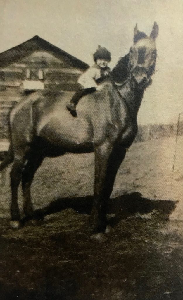 Dean astride a horse. (Photo from the author's family album)