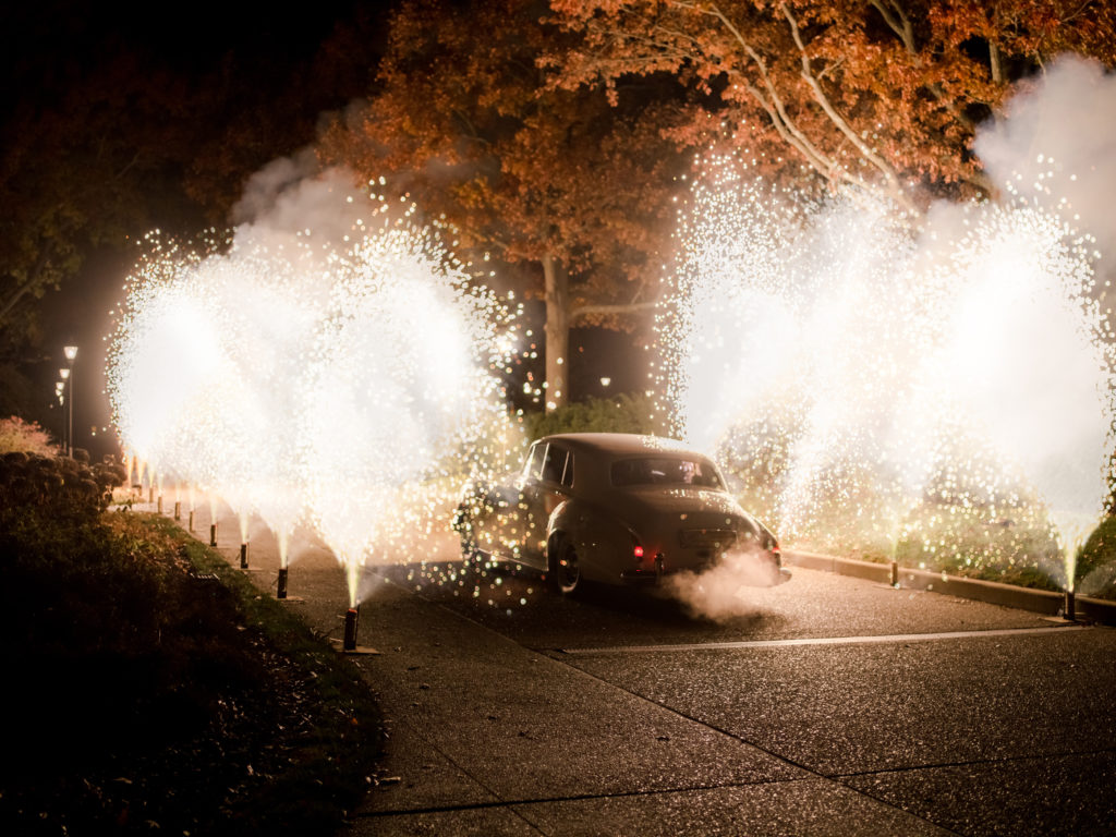 Fort's parents surprised the newlyweds with fireworks as they drove off in a 1960 Silver Cloud II Bentley Rolls-Royce (Photo by Liz Banfield)