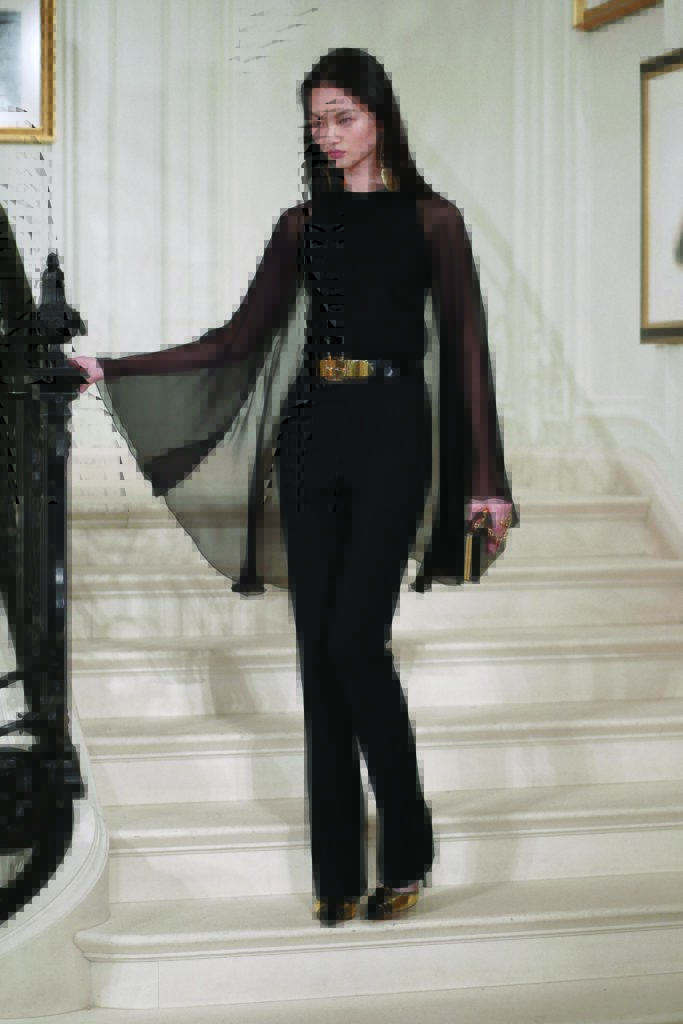 Ralph Lauren black long-sleeve crewneck cape sweater
in black wool crepe, straight-leg pant. Photo by  (Photo by Courtesy of Ralph Lauren)
