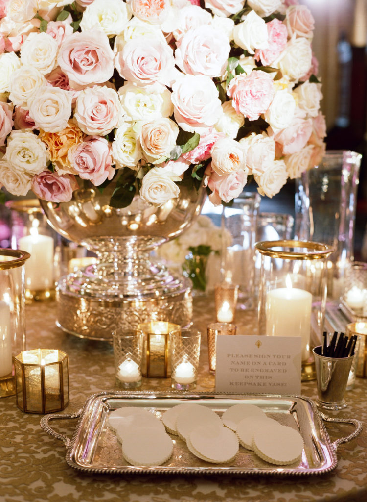 In lieu of a traditional guest book, a table featured three Simon Pearce vases and a note from Fort and Atkinson asking guests to pen personal messages that would later be engraved on the vases and displayed in their home in Dallas (Photo by Liz Banfield)