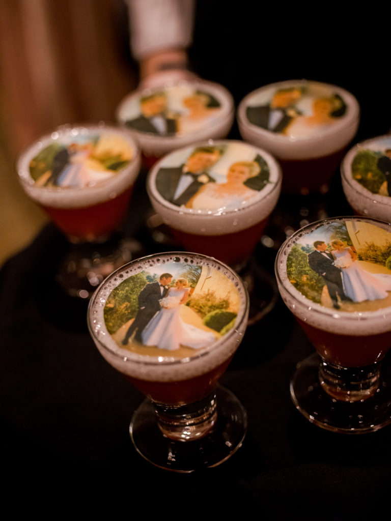 The bride and groom's faces on signature cocktails by The Grand Bevy (Photo by Liz Banfield)