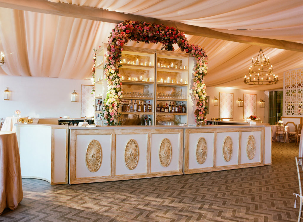 A painted wood facade and cascading roses make a bar into a design statement (Photo by Liz Banfield)
