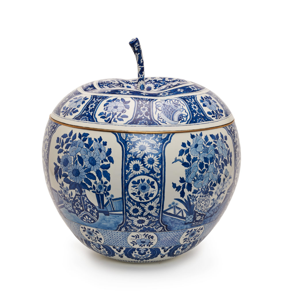 Designer Ann Wolf transformed hers into a blue-and-white Delft pottery-inspired planter with brass inset.