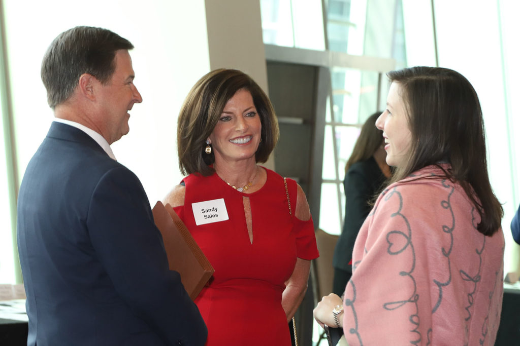 Travis & Sandy Sales, Laura Brogden  at the Houston Bar Foundation luncheon. (Photo by Debi Wallace, Barfield Photography)