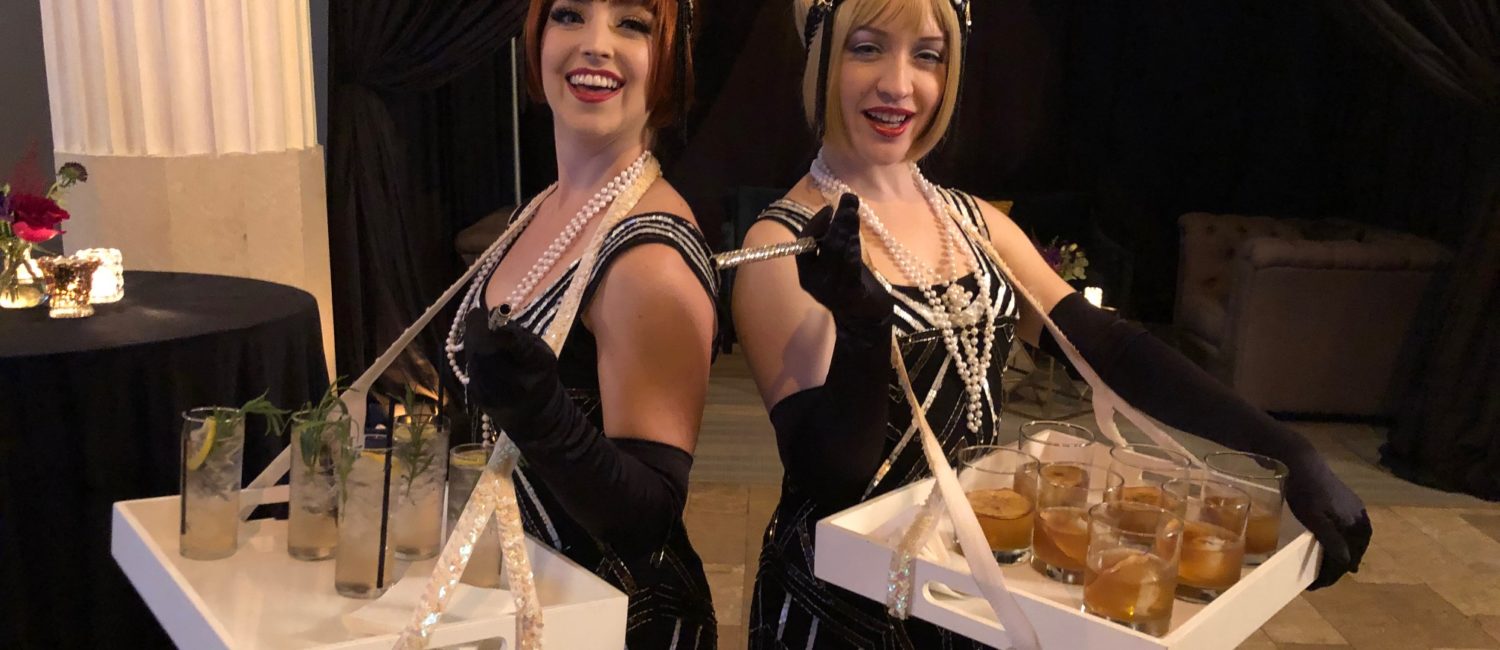 Gin & Tonic and Old Fashioned cocktails are served by '20s era molls.