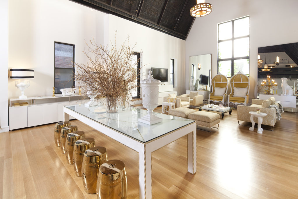 Chinese-inspired garden stools flank the dining table. When needed, Philippe Starck’s lucite “Ghost” chairs for Kartell are brought up from basement storage.  (Photo by Julie Soefer)