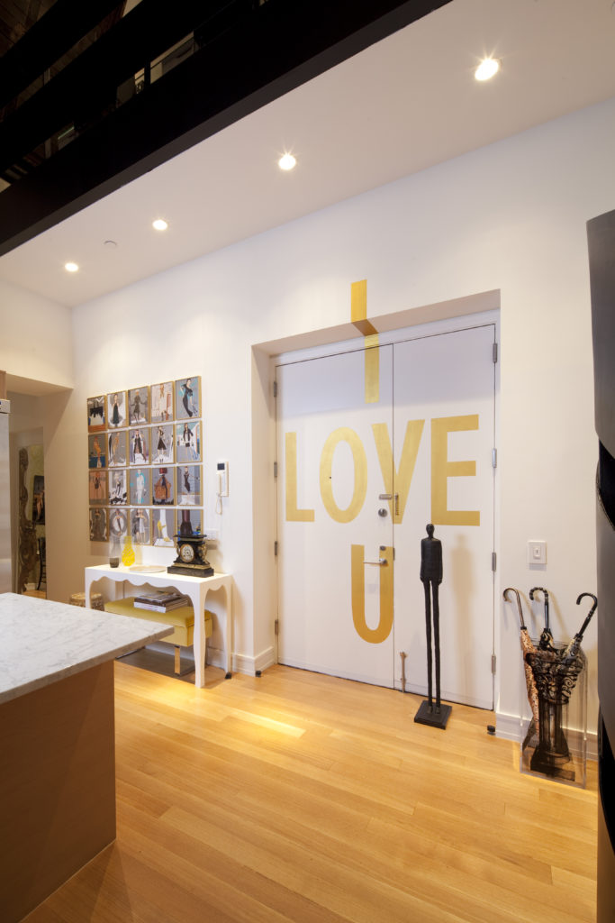 Loya commissioned a New York artist to paint ' love U' on the back of the apartment's front door. (Photo by Julie Soefer)