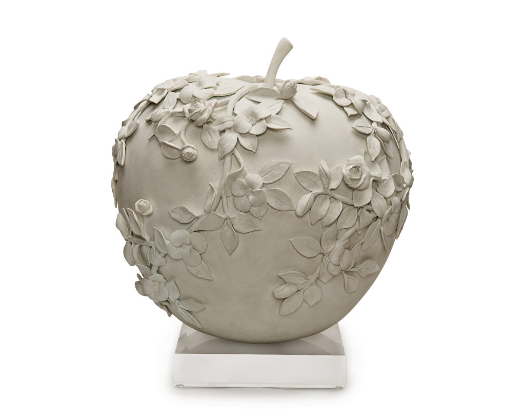 Segreto Finishes plastered their apple and added a bas-relief sculpture of flowers, complete with a lucite base.