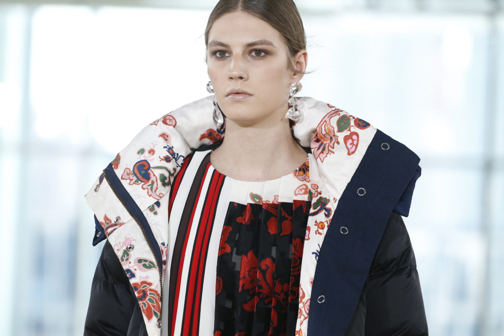 Tory Burch satin down puffer coat with paisley lining, Mountain Paisley print-block chiffon dress, cut-glass earrings (Photo by Tory Burch)