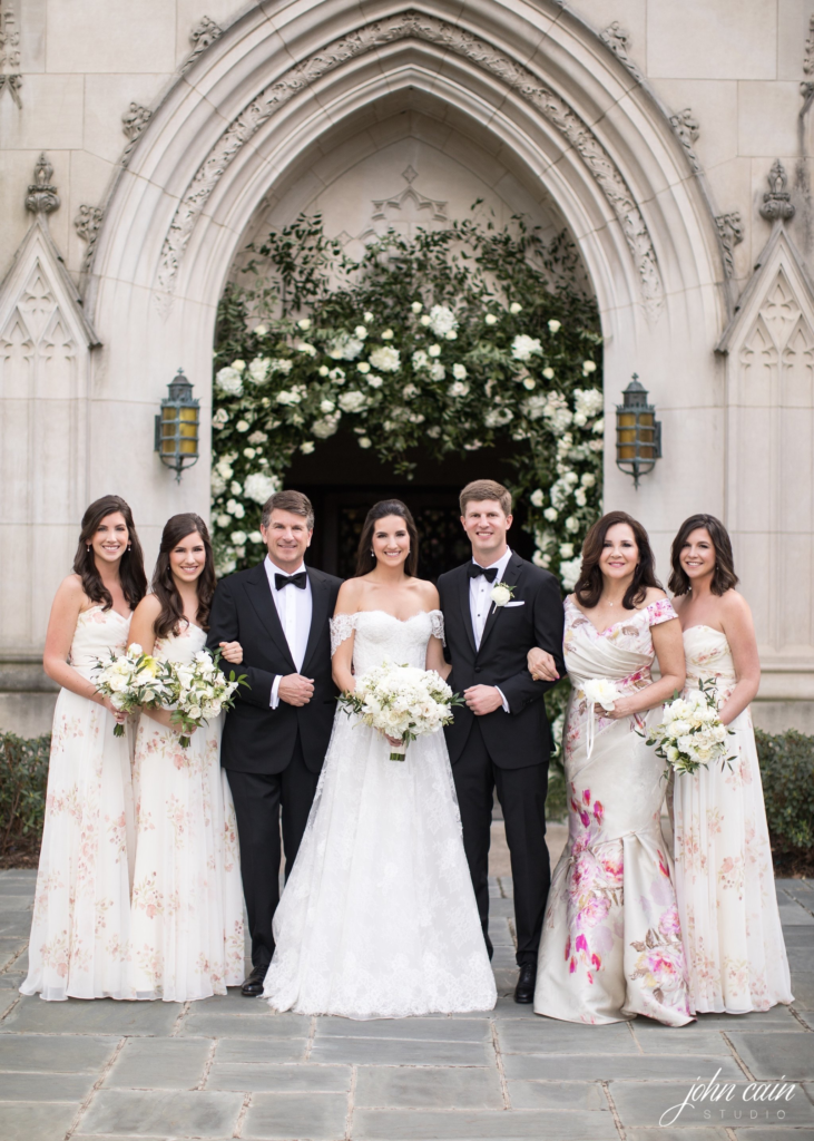 The bridesmaids wore gorgeous pale floral-patterned dresses. (Photo by John Cain Photography)