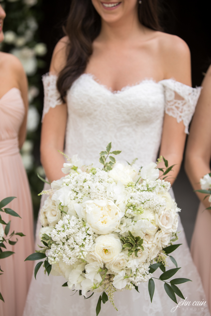 The bouquet was a dazzling array of white roses, majolica roses, renunculas and sweet peas. (Photo by John Cain Photography)