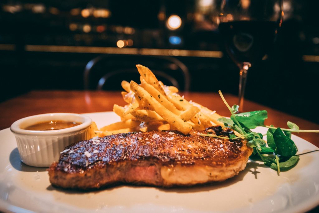 Comfort food, such as Prime NY Steak, is on the menu at Alamo Club.