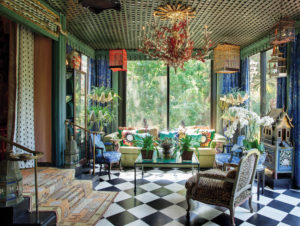 The Green Room with sofa created by Tony Duquette in 1952 for Doris Duke’s “Falcon Lair,” and coral branch, Lucite and iron chandelier created by Hutton Wilkinson in 2005.