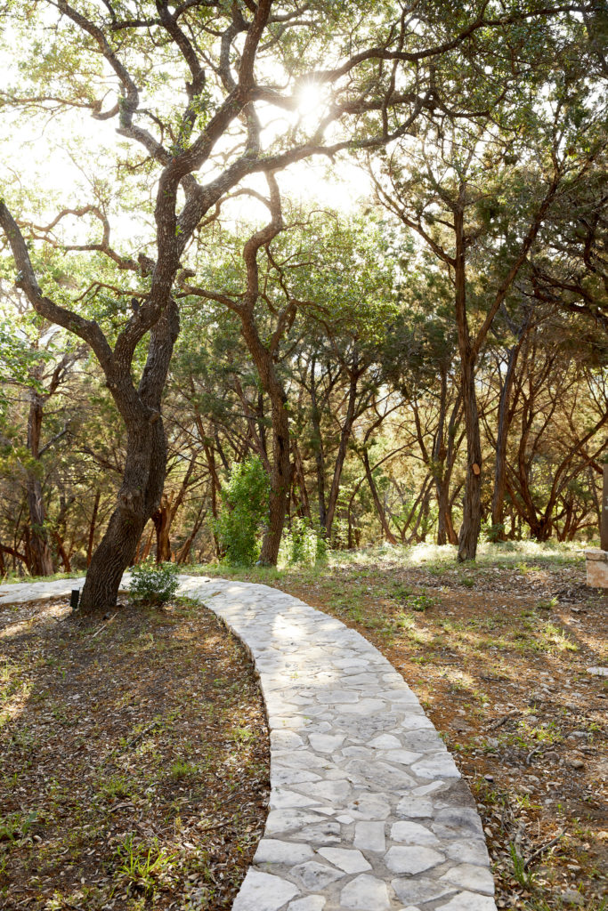 Stone pathways lead through the oaks and cedars that shade Miraval Austin. (Miraval Austin Photo)