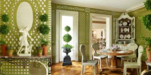 Custom Gracie wallpaper panels painted with green trellising over silver paper create the feeling of a mirrored, latticed room.