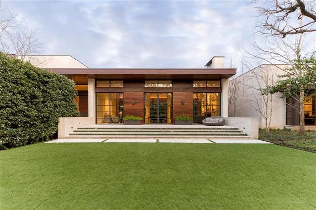 The backyard's landscaping is extensive and lush. 