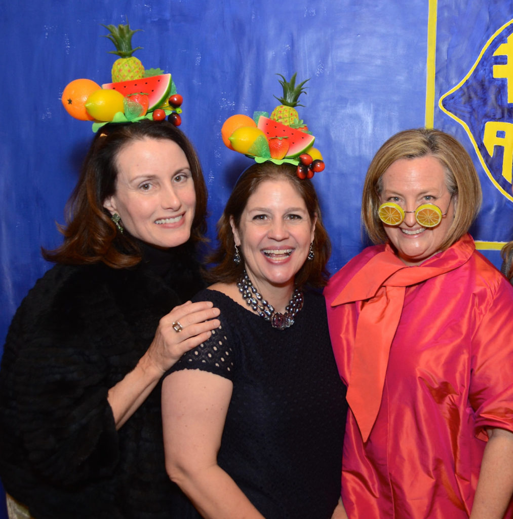 Houston Center for Photography 2019 auction chairs Karen Chiao, Libbie Masterson, and gallerist Bryn Larsen. Larsen, whose sense of fun is in play in this photo, recently commissioned Diane Gelmen for a sweet-shop installation for her new casa. (Photo by Roswitha Vogler)