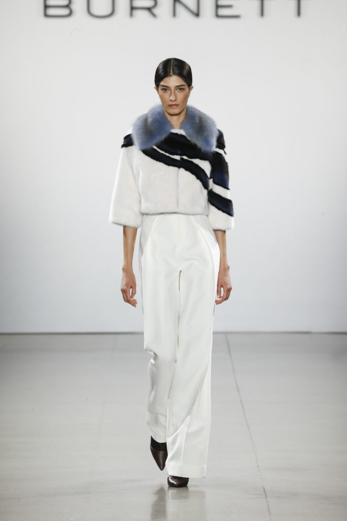 Burnett New York blue, ivory and black wave cropped coat with ivory pleated pant. (Photo by Burnett New York)