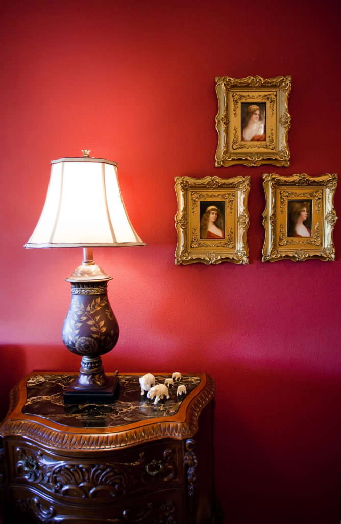 Homey touches and crimson walls fill the Bayou Lofts apartment with special warmth.
