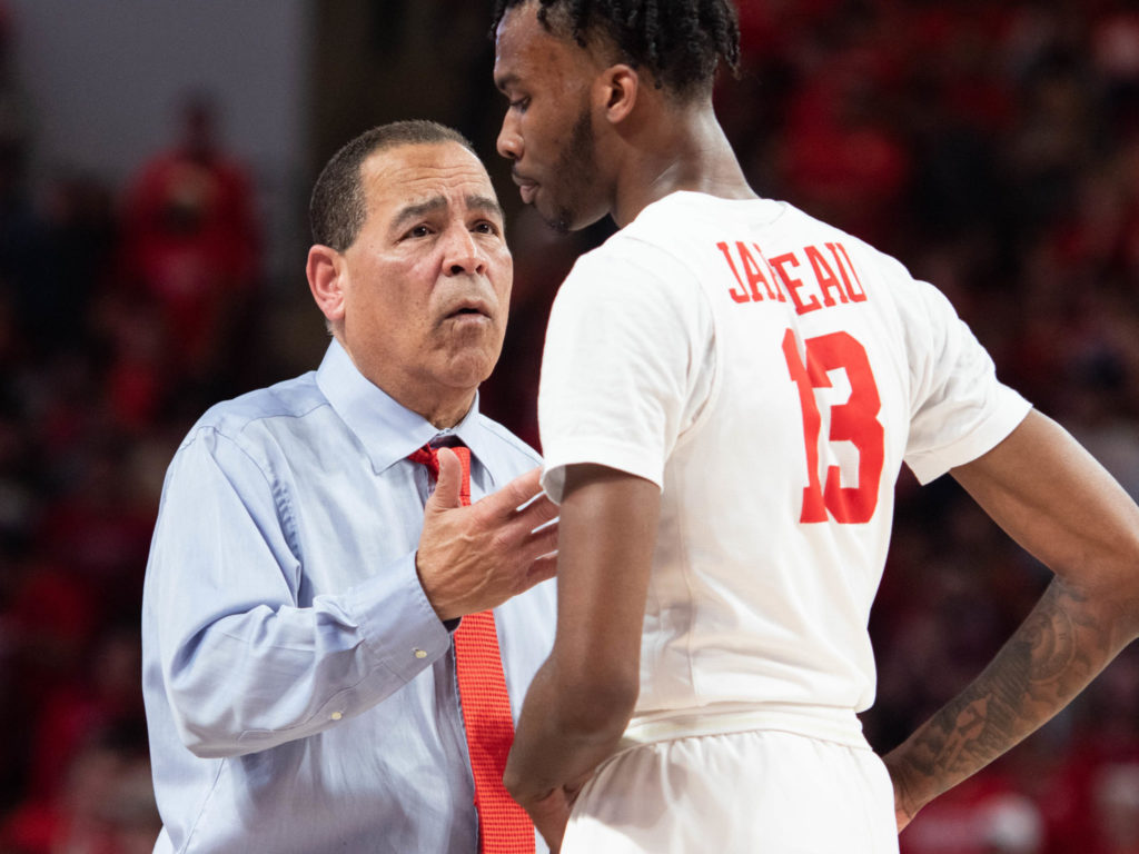 University of Houston Cougars won a share of the American Conference title defeating SMU Thursday night at the Fertitta Center. Head Coach Kelvin Sampson holds aloft the trophy and cuts down the net