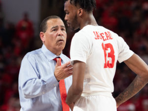 University of Houston Cougars won a share of the American Conference title defeating SMU Thursday night at the Fertitta Center. Head Coach Kelvin Sampson holds aloft the trophy and cuts down the net
