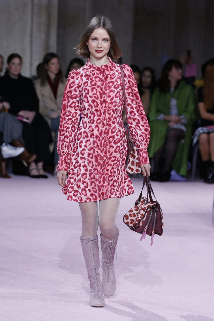 Kate Spade New York red leopard print dress mini-dress and matching handbag, with lace-up boots. (Photo by Kate Spade New York)