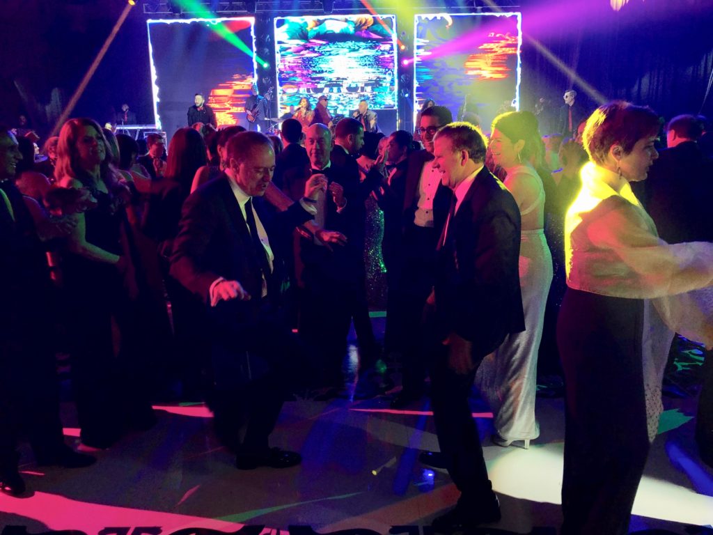 Jeffries CEO Rich Handler and Tilman Fertitta on the dance floor at the San Luis Salute.