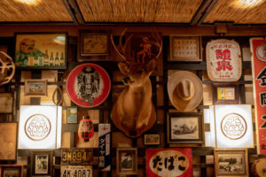 Interior Decor, mix of Japanese and Texan vintage signs and decor_Credit: Julia Keim