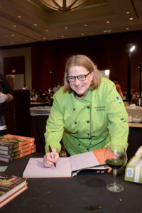 Elizabeth Stone autographs her book, ‘An Invitation to Entertaining,’ at the Youth Development Center Bon Vivant (Photo by David Postma, Genesis Photographers)