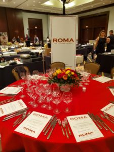 Chef Angelo Cuppone and his team and Roma dress their table for the Youth Development Center Bon Vivant (Photo by Shelby Hodge)