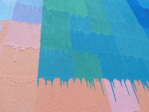 A detail of a drip: besides being a vibrant piece of street art, this mural possesses content. (Photo by the author)