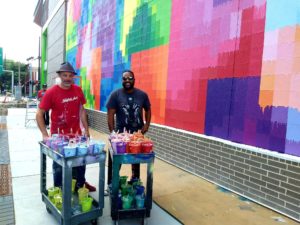 Mr. D and filmmaker Neiman Catley on the final day of wrapping “Pearl Paint Wall” (Photo by the author) 