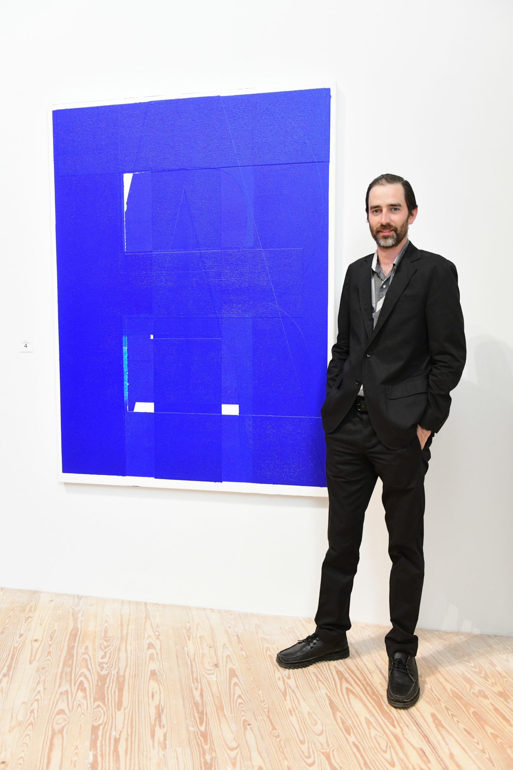 Will Boone with his live auction canvas “Threat,” 2018, at the 2019 CAMH Gala and Art Auction (Photo by Daniel Ortiz) (Photo by Daniel Ortiz)