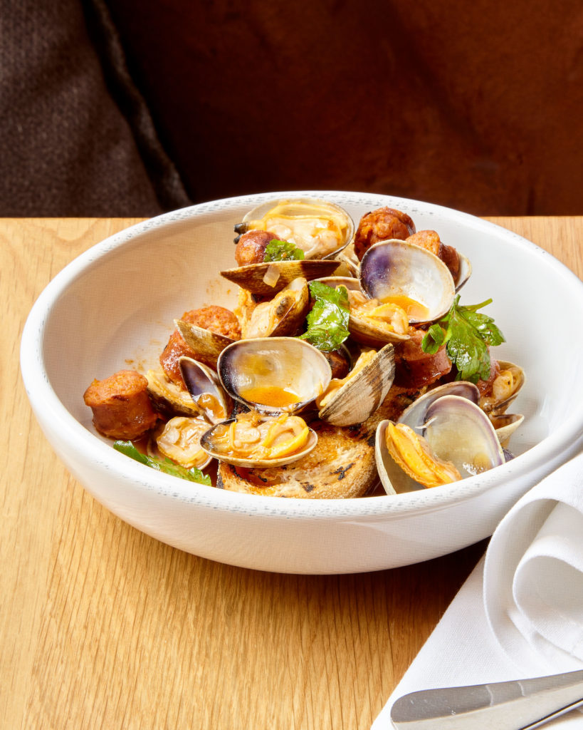 Manila clams with chistorra and focaccia (Photo by Chris Plavidal )